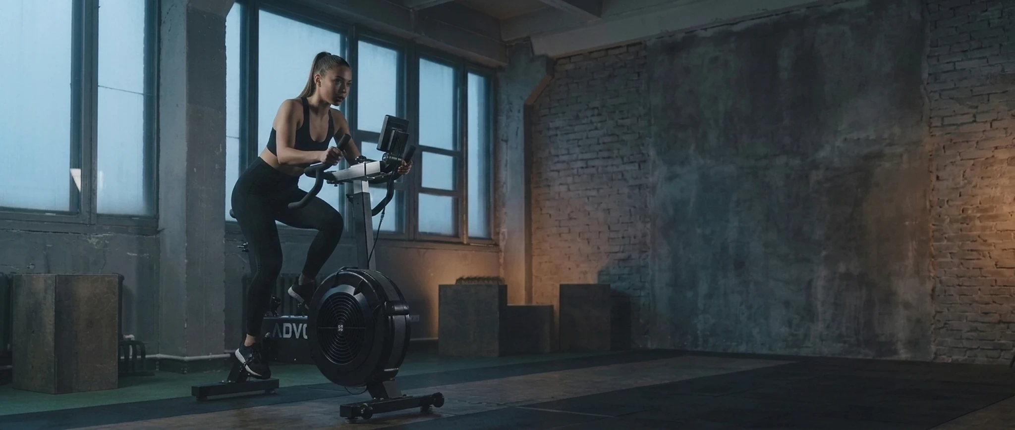 Woman doing a cardio workout on an ADVG air bike