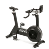 ADVG BikeErg air-resistance exercise bike, all-black with chrome accents and steel fan mesh ring, 3/4 view