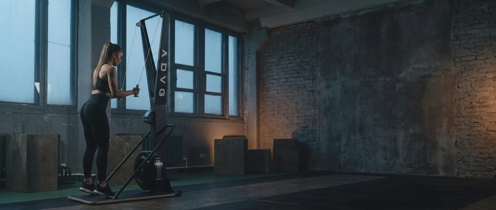 Woman training on an ADVG ski-erg in a gym