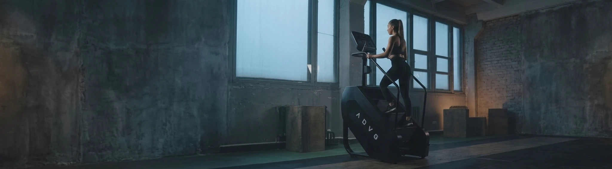 Woman working out on an ADVG stair climber