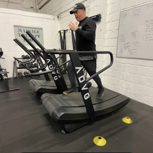 ADVG Commercial Curved Treadmill CurveMax 1.0 in use in a gym