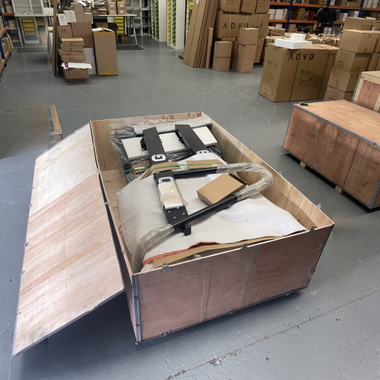 ADVG CurveMax 1.0 curved treadmill in its open wooden shipping crate in the ADVG warehouse