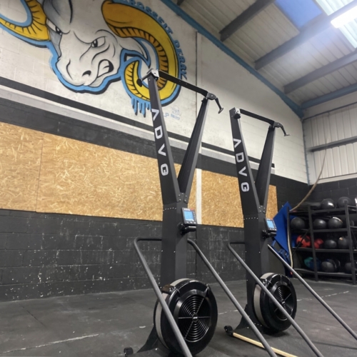 ADVG SkiErg and Stand PowerMax 1.0, two machines side by side in a gym with a painted mural