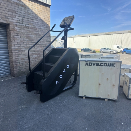 ADVG StepMaster 1.0 full side view in the yard beside a shipping crate
